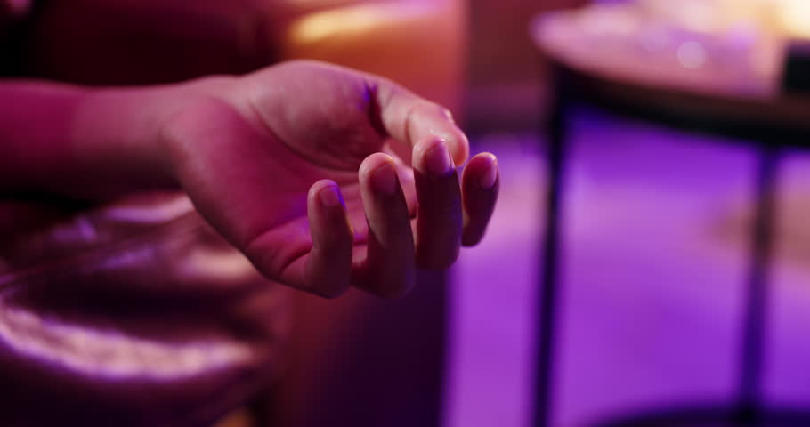 Drug abuse, death and hand of person on sofa with ambulance for medical emergency, crisis and accident. Substance abuse, dark home and closeup with siren lights for overdose, addiction and help