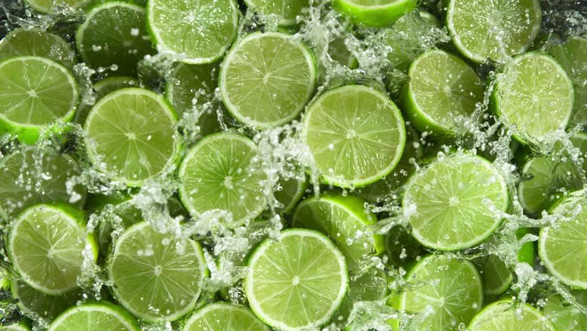Super Slow Motion Shot of Splashing Fresh Limes . Filmed on High Speed Cinematic Camera at 1000fps . - Powered by Shutterstock - Get 15% off with code: PIKWIZARD15