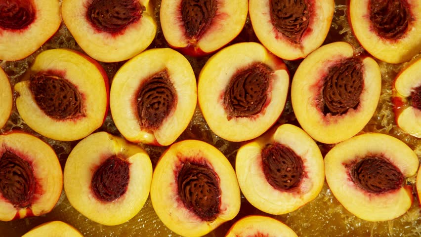 Super Slow Motion Shot of Splashing Fresh Peaches . Filmed on High Speed Cinematic Camera at 1000fps .
