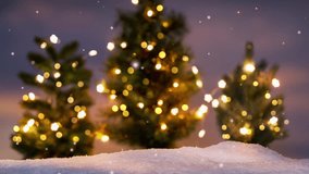 illuminated blurred christmas trees with snowflake animation in winter landscape background at night with copy space, bright contemplative merry xmas backdrop - Powered by Shutterstock - Get 15% off with code: PIKWIZARD15