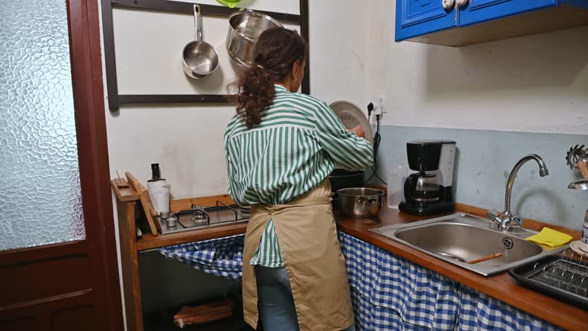 Woman cooking in cozy kitchen