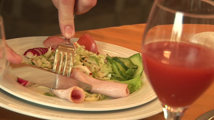Man dines in a restaurant salad vegetables and meat