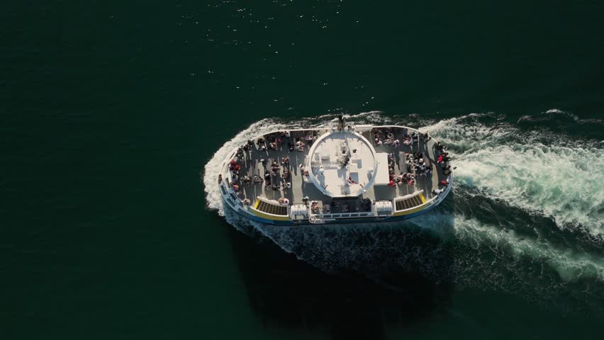 Top View. The Historic Halifax Ferry Transports Passengers Across The Harbor, With A Scenic Aerial View Of The City Waterfront And Skyline At Sunset. Halifax, Nova Scotia, Canada 