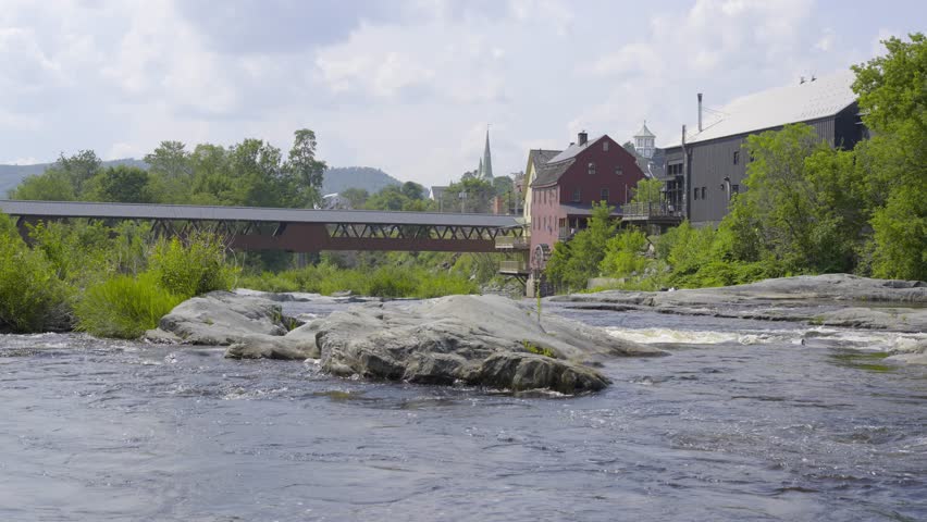 Littleton New Hampshire and the Riverwalk Covered Bridge over the Ammonoosuc River. 4k Video.