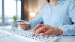 Woman Typing Credit Card Number on a Computer Keyboard to Complete an Online Purchase, Utilizing an Online Payment Service for Secure E commerce Transactions, Demonstrating the Simplicity of Digital - Powered by Shutterstock - Get 15% off with code: PIKWIZARD15