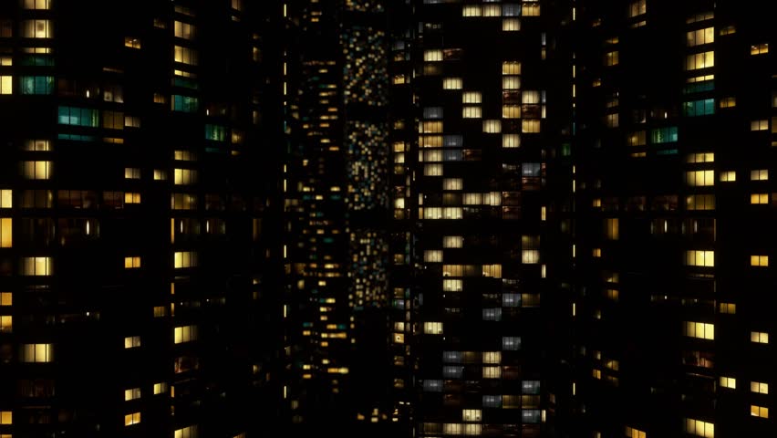 Drone view of metropolitan skyscraper block at night. tall buildings with shiny windows of a modern city