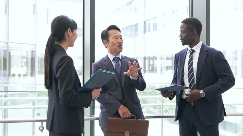 Group of multinational business people having a conversation in a lobby