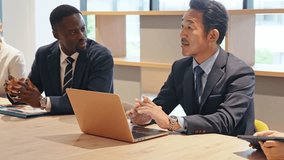 A group of multinational business people having a meeting - Powered by Shutterstock - Get 15% off with code: PIKWIZARD15