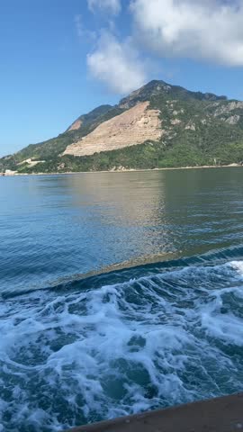 oyster farming fishing boats passing through the blue sea 