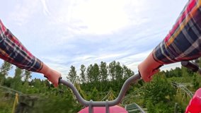 A first-person motorbike roller coaster experience in an amusement park, capturing the excitement of each twist and turn - Powered by Shutterstock - Get 15% off with code: PIKWIZARD15