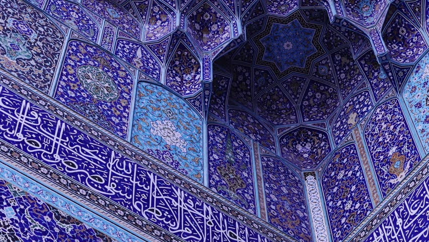 Ceiling at Imam Mosque, arch at the entrance, Naghsh-e Jahan Square, Isfahan, Iran. Beautiful oldest iranian mosque interior design. Unique mosaics and ornaments. A masterpiece of Persian architecture
