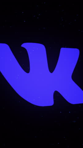 Digital animation of VKontakte app icon decaying into multicolored moving plexus networks on black background. animation. Animation. Technology, social media and internet backdrop.