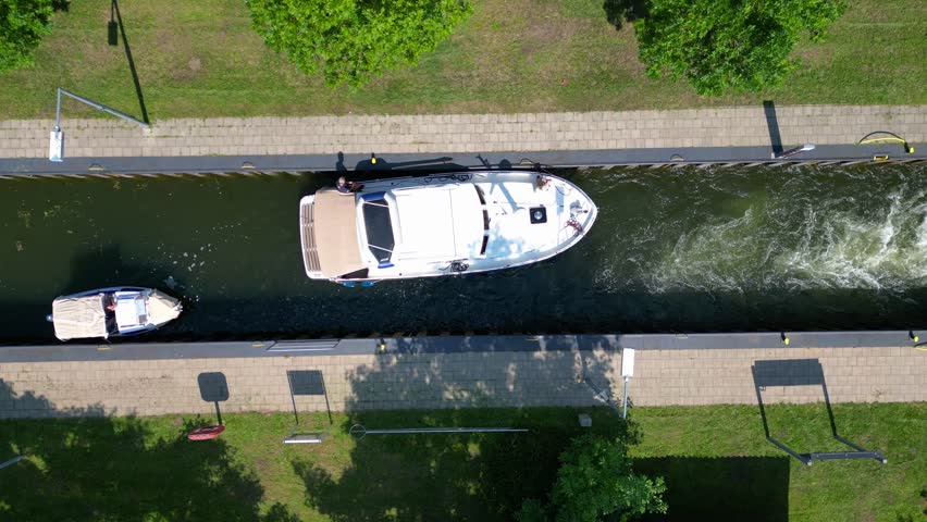boats in sluice canal lock on summer day. Perfect aerial view flight drone