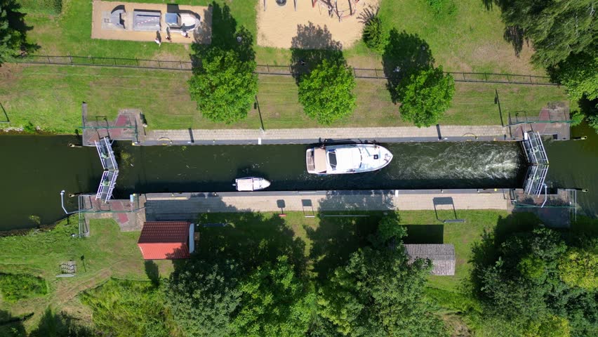 boats in sluice canal lock on summer day. Unique aerial view flight drone