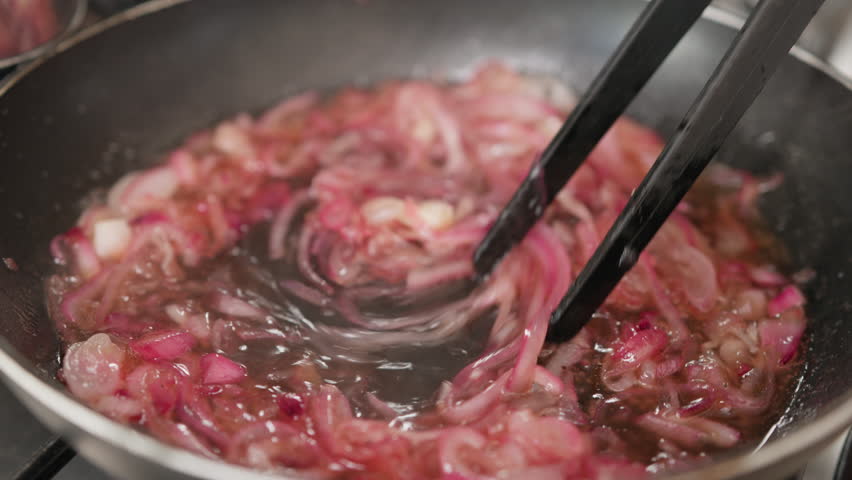 Cooking Caramelized Onion In A Non-Stick Pan In The Kitchen