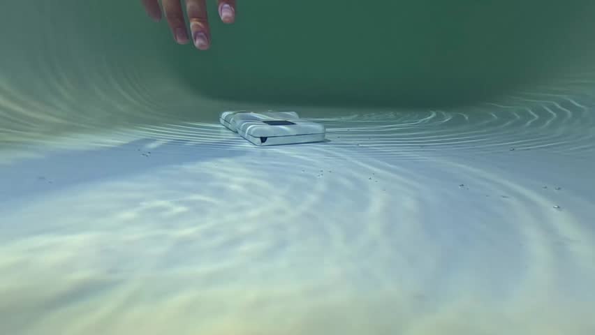 man finds an old forgotten console with games underwater at the bottom 
