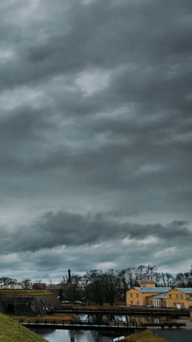 Kuressaare, Saaremaa Island, Estonia. Time-lapse Timelapse Episcopal Castle In Evening. Traditional Medieval Architecture, Famous Attraction Landmark. Clouds Fast Moving In Sky, Passing Evening Into
