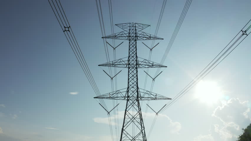 Transmission tower in aerial view. May called electricity pylon, steel utility pole consist of steel structure framing to support carry high-voltage cable or overhead power line for electrical grid.