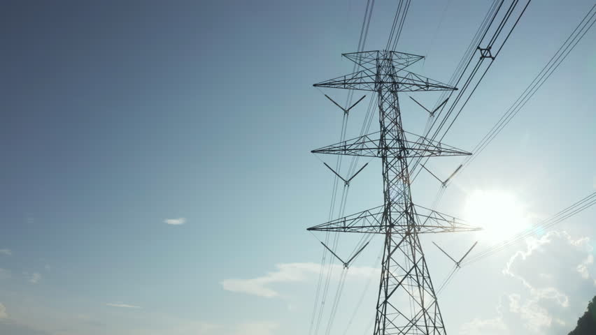 Transmission tower in aerial view. May called electricity pylon, steel utility pole consist of steel structure framing to support carry high-voltage cable or overhead power line for electrical grid.