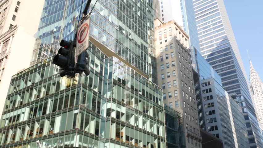 New York City Manhattan Midtown 42 street architecture. Chrysler building, iconic high-rise skyscraper, USA. American urban tower, United States. 5 Fifth 5th avenue crossroad near Bryant Park, Library