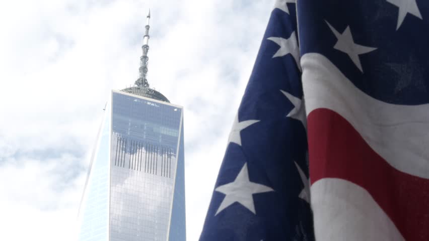 New York, american flag waving. World Trade Center. Manhattan downtown. Symbol of freedom, democracy, liberty, patriotism. Star-Spangled Banner, Old Glory. Stars and Stripes. 11 September memorial day