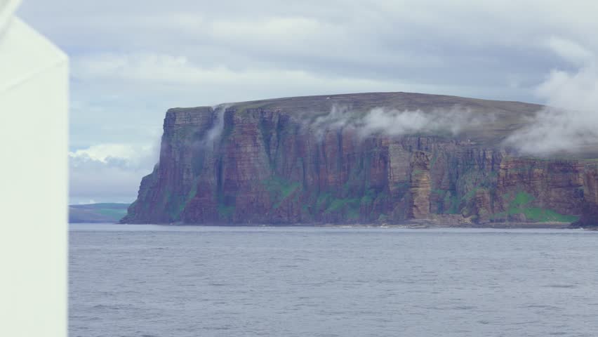 St. John’s Head and Old Man of Hoy on foggy Orkney coast