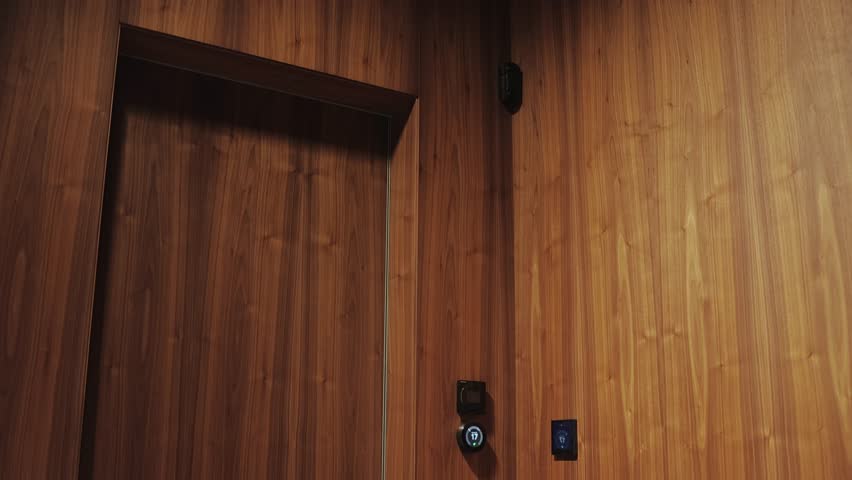 A contemporary Modern Wooden Elevator featuring advanced Touch Controls for ease of use
