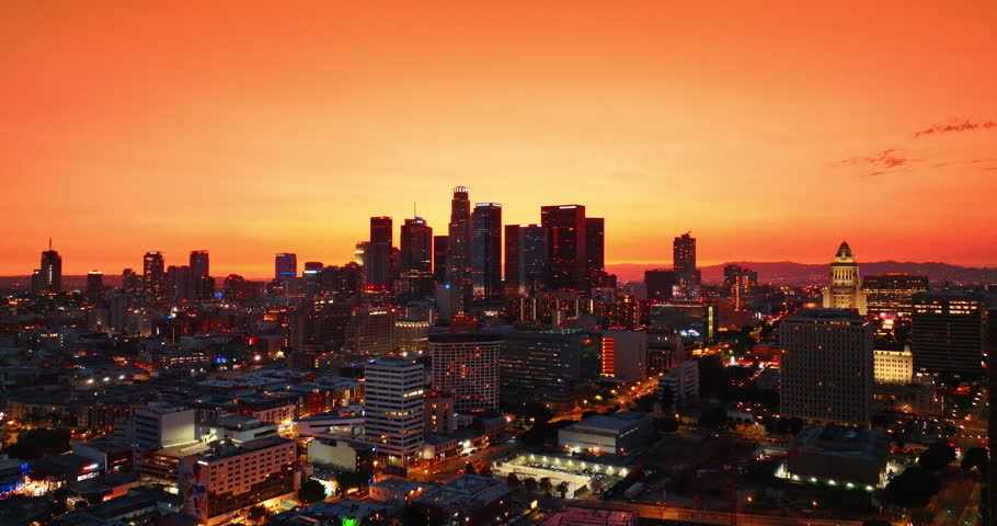 Beautiful scenery of modern Los Angeles, California, USA at sunset. Panorama of amazing city in orange light. Aerial perspective.