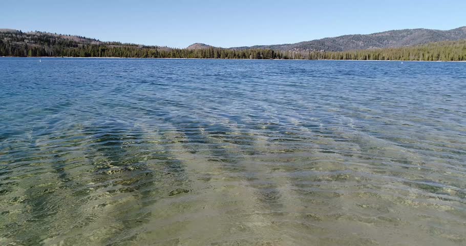 low angle drone shot of redfish lake in stanley idaho