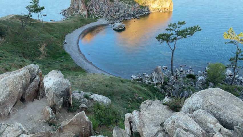 Lake Baikal, Khuzhir, view from the shore of the Shamanka rock at dawn. 4K footage