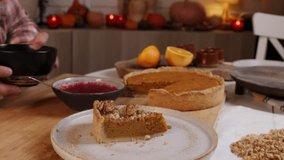 a man decorates a pumpkin pie with whipped cream and pecans - Powered by Shutterstock - Get 15% off with code: PIKWIZARD15