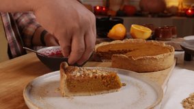 a man decorates a pumpkin pie with whipped cream and pecans - Powered by Shutterstock - Get 15% off with code: PIKWIZARD15