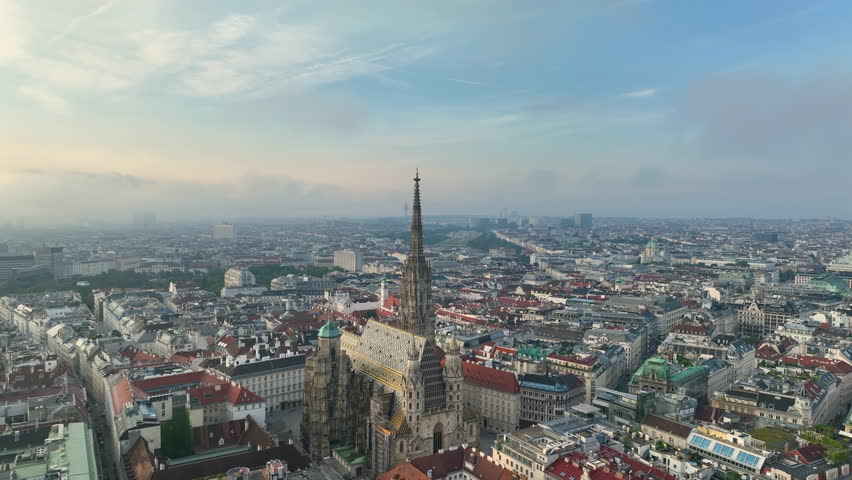 Aerial view of famous places Vienna skyline at sunrise fog, Austria. Old town and new buildings at sunrise river Donau