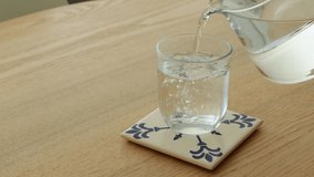 Clean drinking water filling glass on table in kitchen aesthetic - Powered by Shutterstock - Get 15% off with code: PIKWIZARD15