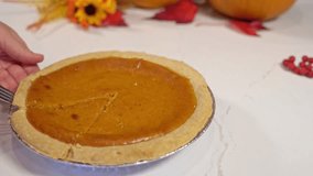 taking a piece of pumpkin pie on thanksgiving - Powered by Shutterstock - Get 15% off with code: PIKWIZARD15