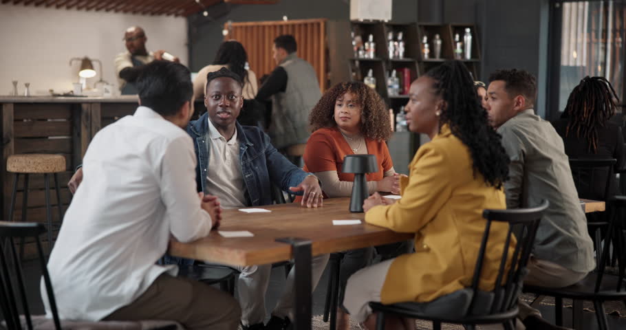 Diversity, friends and talking in restaurant, group and bonding with discussion, listening and reunion. Serious, conversation and conspiracy theory for politics, people and sharing views at night