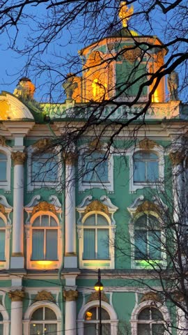 ST. PETERSBURG - APRIL 09, 2023: The Winter Palace in the night illumination on a cloudy April night. Evening view of the State Hermitage Museum in St. Petersburg. Museum on Palace Square. 4К