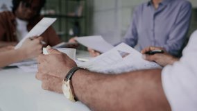 Businessman drinking coffee during meeting with colleagues - Powered by Shutterstock - Get 15% off with code: PIKWIZARD15
