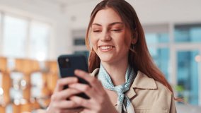 Creative agency, woman and smile with phone for chat, reading and online communication with contact. Female person, designer and laughing with mobile app for joke, comment and social media in office - Powered by Shutterstock - Get 15% off with code: PIKWIZARD15