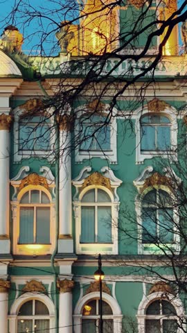 ST. PETERSBURG - APRIL 09, 2023: The Winter Palace in the night illumination on a cloudy April night. Evening view of the State Hermitage Museum in St. Petersburg. Museum on Palace Square. 4К