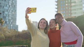 Cheerful friends are taking a selfie picture in a park enjoying the fun together. High quality 4k footage - Powered by Shutterstock - Get 15% off with code: PIKWIZARD15