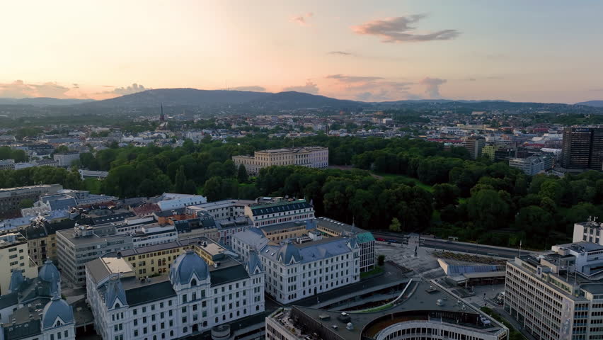 4K aerial video of the Royal Palace (Det kongelige slott) and Statue of King Karl Johan Oslo. In the background the castle park. Oslo, Norway.