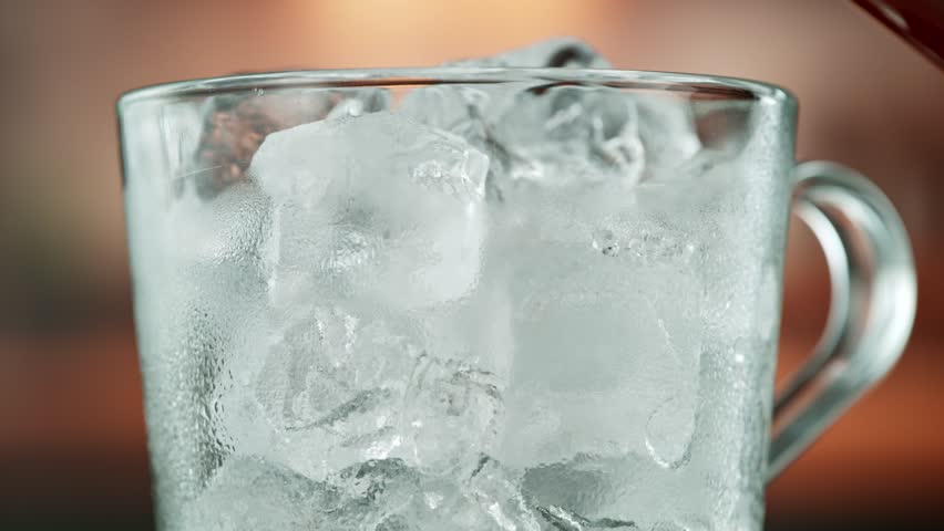 Super Slow Motion Shot of Pouring Milk into Ice Coffee , Filmed on High Speed Cinematic Camera
