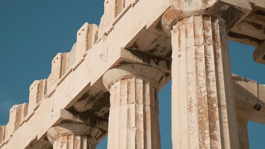 Close up of columns of Parthenon temple on the Acropolis in Athens, Greece. Ancient Greek architecture. Popular travel and touristic landmark