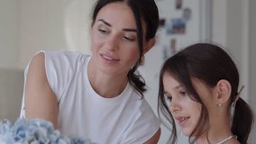 Mother and daughter create beautiful floral arrangements at home in a cozy setting - Powered by Shutterstock - Get 15% off with code: PIKWIZARD15