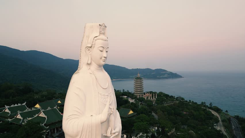 Lady Buddha at Sunset - Epic Aerial Done View of this incredible temple in the hills of Da Nang, Vietnam - Tourism Feature for Worldwide Tourists