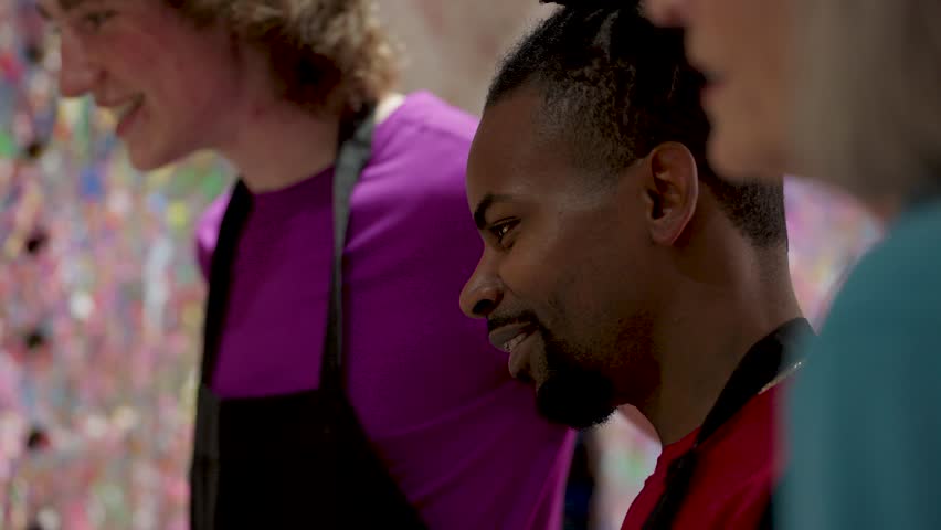 art class participant watching classmate