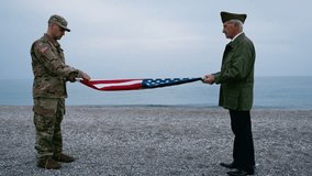 Soldier And Veteran Folding The USA Flag Together  - Powered by Shutterstock - Get 15% off with code: PIKWIZARD15