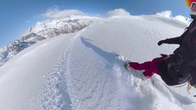 SELFIE, POV: Enjoying a sunny day in high mountains, snowboarder rides through deep, untouched snow, expertly carving and turning with grace. Picturesque snowboarding adventure in snowy Albanian Alps. - Powered by Shutterstock - Get 15% off with code: PIKWIZARD15