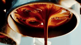 4K Pouring coffee stream from professional machine in cup. Barista man making double espresso, using filter holder. Flowing fresh ground coffee. Drinking roasted black coffee in the morning. - Powered by Shutterstock - Get 15% off with code: PIKWIZARD15